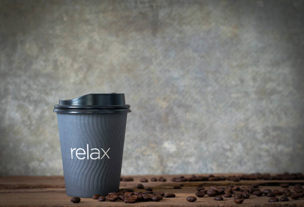 hot coffee on woonden table with coffee bean