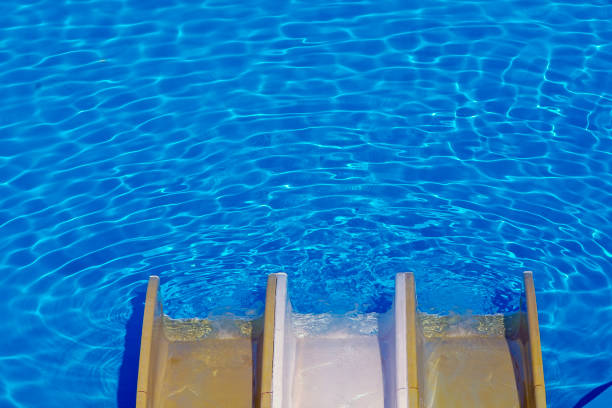 Sliding into the swimming pool