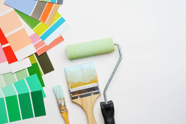 istock Image of palette with blue and green colors, roller, brushes 1160790540
