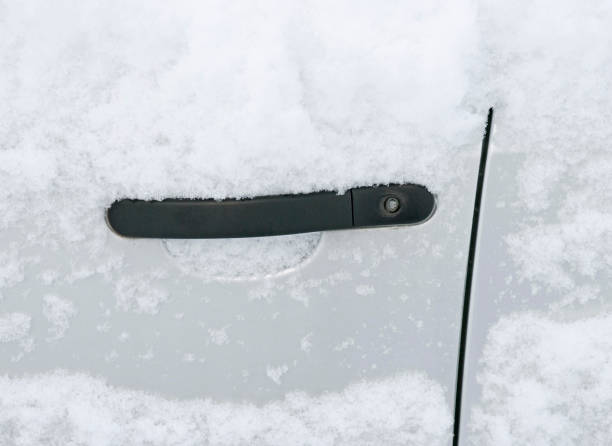 istock snow on car door 1160793133