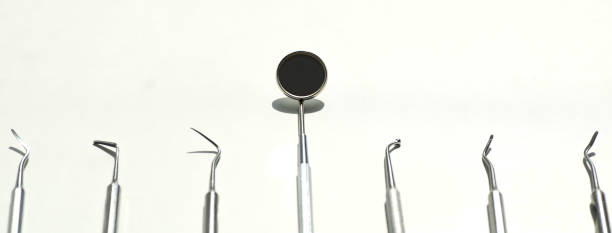 istock a various dental tools laid out flatlay on a light background 1160793833