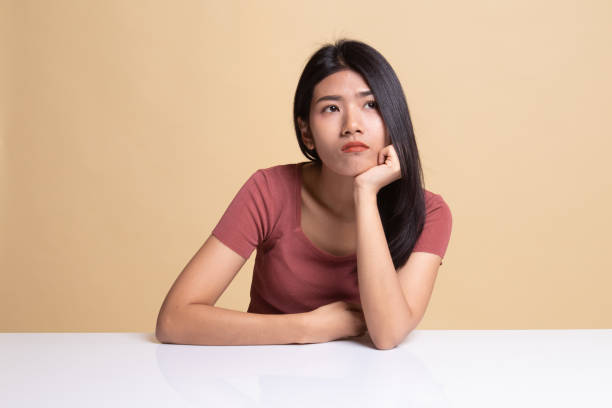 istock Asian girl is getting bore. 1160795043