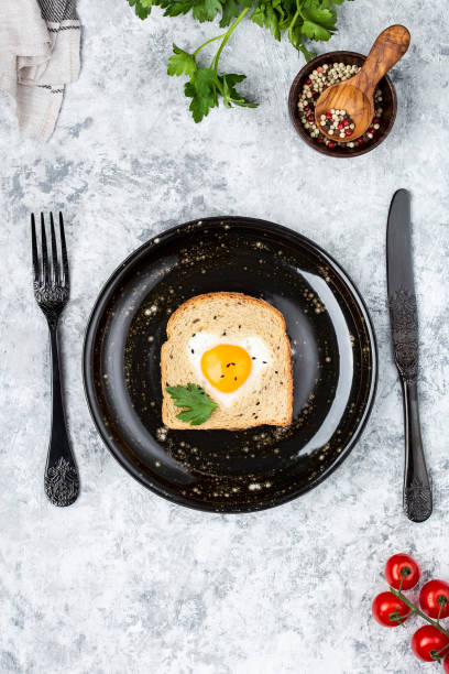 istock heart shaped cooked egg on a slice of toast 1160795272