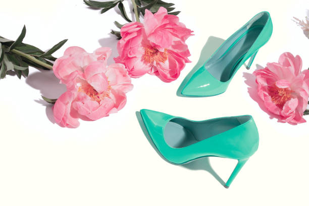 istock Coral peony layout with bright blue green lacquer high heel pumps 1160795440