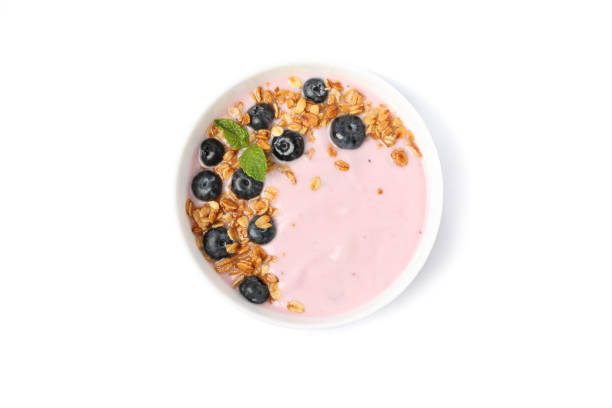 istock Yogurt with granola, blueberry and mint isolated on white background 1160796532