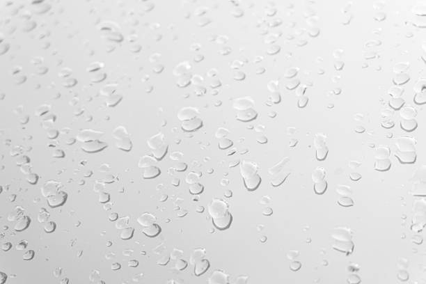 istock Water drops on glass white gray background. 1160796705