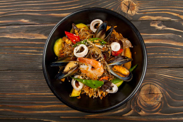 istock asian noodles with seafood and vegetables 1160796716