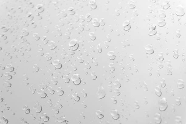 istock Water drops on glass white gray background. 1160796795