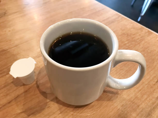 istock Cup of coffee in a diner table 1160797100