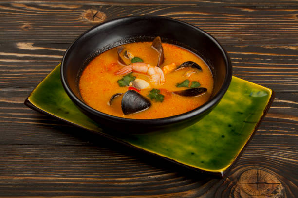 istock soup with seafood on wooden background 1160797343