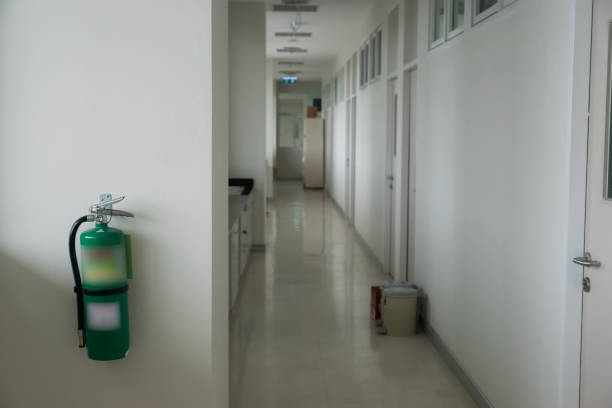 istock Fire extinguisher install front of the room. Security system concept. 1160797555