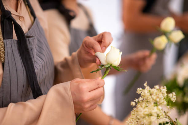 istock Florist arranging rose petal in flower workshop 1160798428