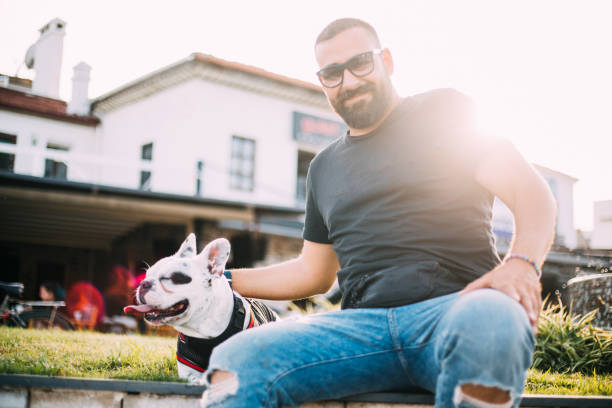 istock French Bulldog dog with his owner 1160799009