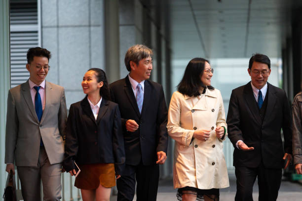 istock Business people walking outside workplace 1160799138