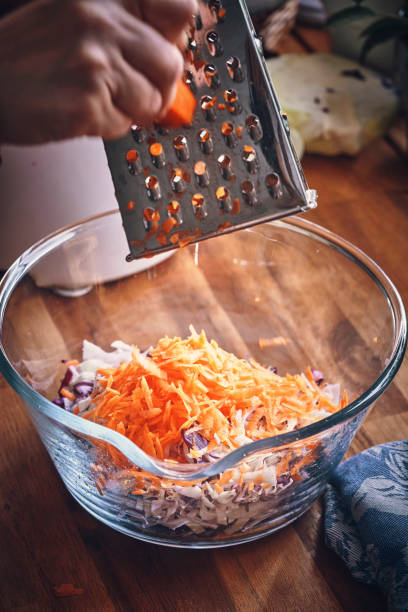 istock Preparing Cole Slaw Salad in Domestic Kitchen 1160799663