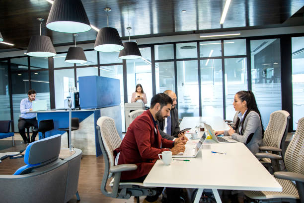 istock men and women in offices 1160799717