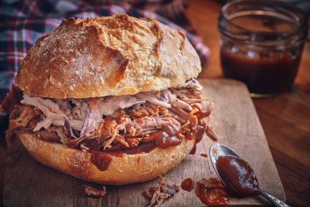 istock Pulled Pork Wrap Sandwich with Coleslaw Salad and Barbecue Sauce 1160800391