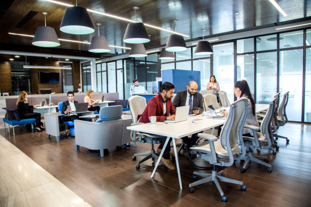 istock men and women in offices 1160800728