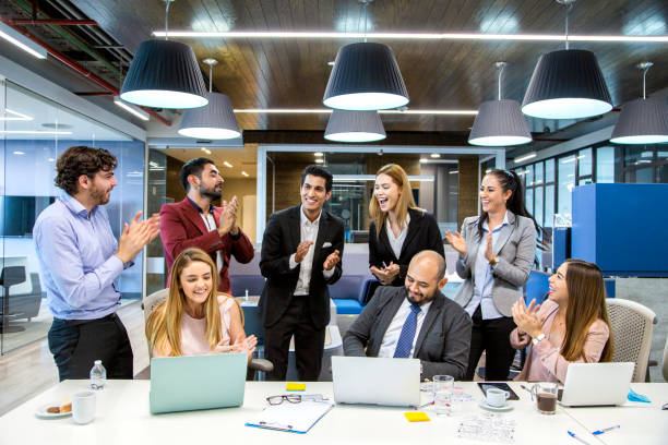 istock men and women in offices partying 1160801242