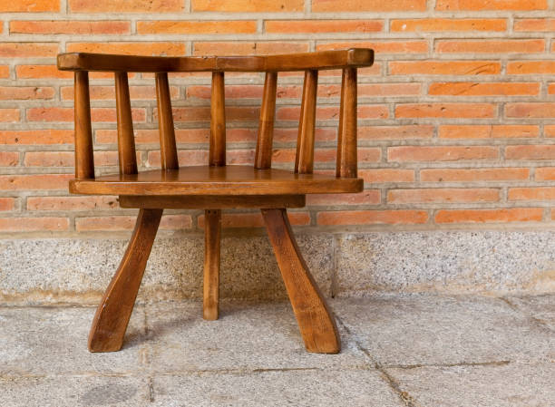 istock Chair against the background of brick wall 1160801845