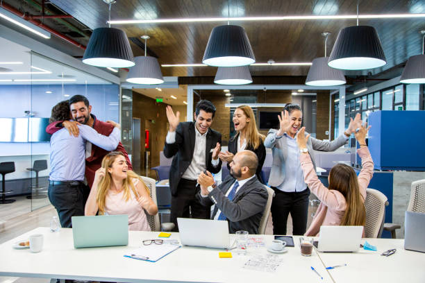 istock men and women in offices partying 1160801876