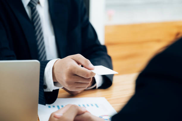 istock Businessman giving a business card. 1160802335