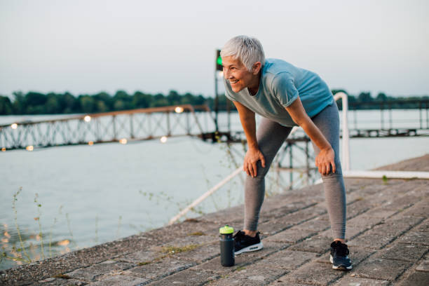 istock Woman resting after a jog 1160804565