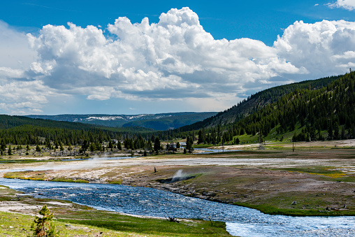 Yellowstone River winding through the summer landscape of Hayden Valley in Yellowstone National PArk Wyoming, USA.