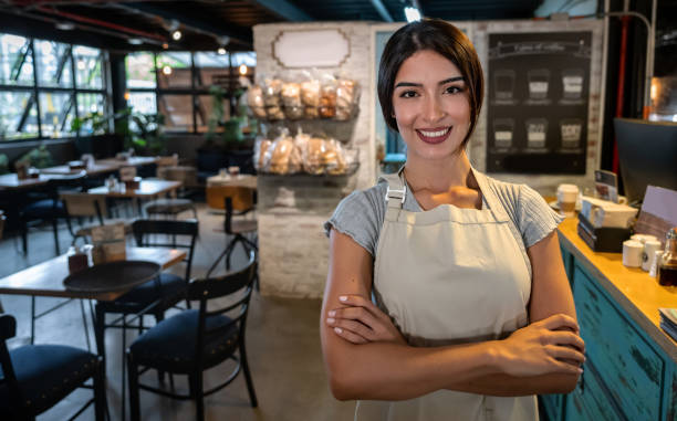 istock Woman working as a waitress at a coffee house 1160805937