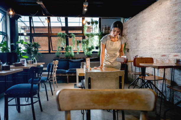 istock Waitress cleaning up at a restaurant 1160805955