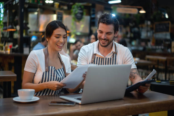 istock Staff doing the books at a restaurant 1160806093