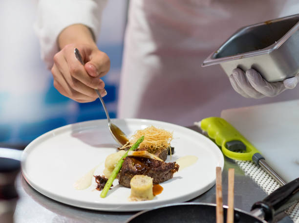 istock Chef cooking food in the kitchen, Chef preparing food 1160806369