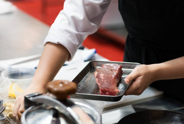 istock Chef cooking food in the kitchen, Chef preparing food 1160806371