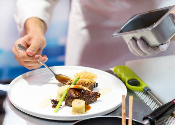istock Chef cooking food in the kitchen, Chef preparing food 1160806376
