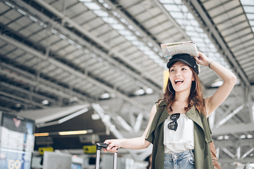 Asian women tourists delighted when she met fellow travelers in the airport
