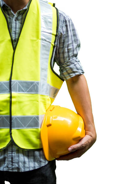 istock Engineering man standing with yellow safety helmet isolated on white background 1160810644