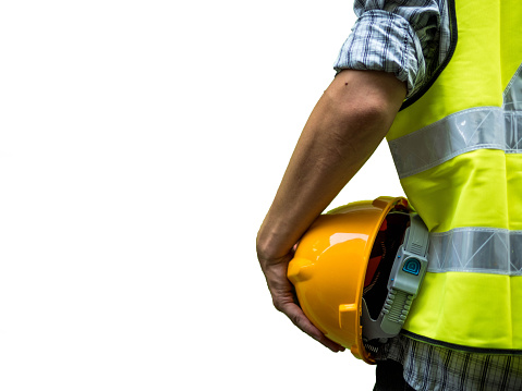 Engineering man standing with yellow safety helmet isolated on white background