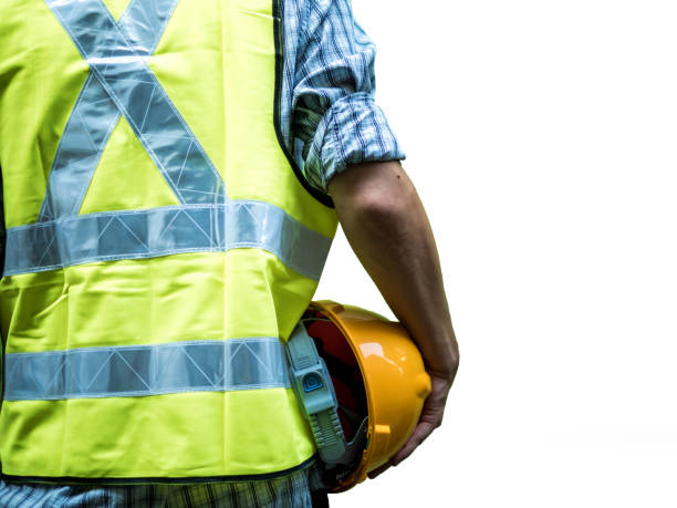 istock Engineering man standing with yellow safety helmet isolated on white background 1160810648