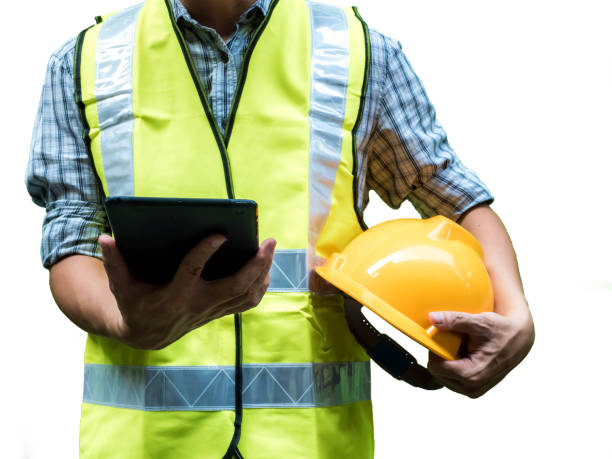 istock Engineering man standing with yellow safety helmet and holding tablet  isolated on white background, work concept 1160810650