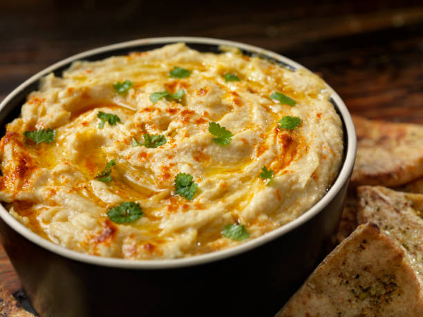 istock Roasted Garlic Hummus with Pita Chips 1160810888