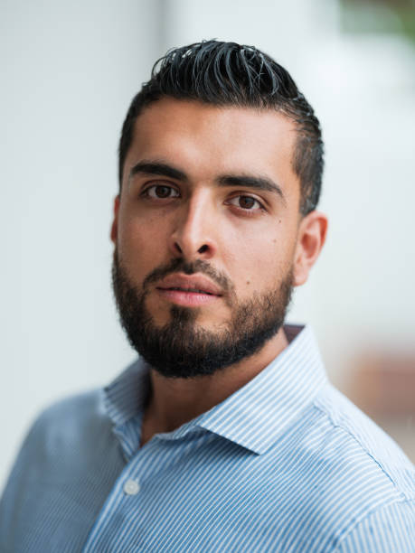 istock Latin adult man looking at the camera with serious expression 1160811065