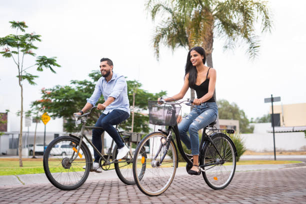istock Happy couple taking a stroll in their bicycles together 1160811106
