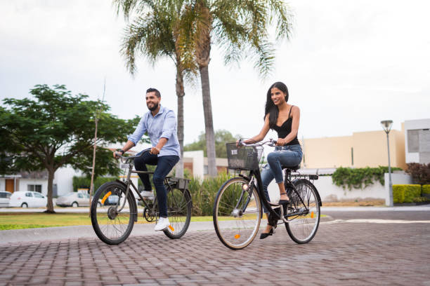 istock Young couple enjoying an afternoon with their bikes 1160811107