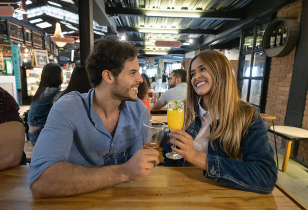istock Happy couple having drinks at a restaurant 1160815958