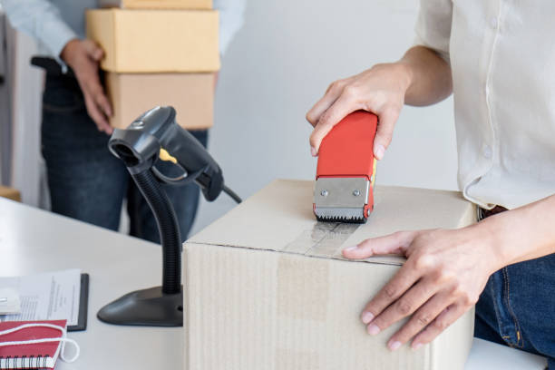 istock Young entrepreneur SME receive order client and working with packaging sort box delivery online market on purchase order and preparing package product, Small business parcel for shipment 1160817561