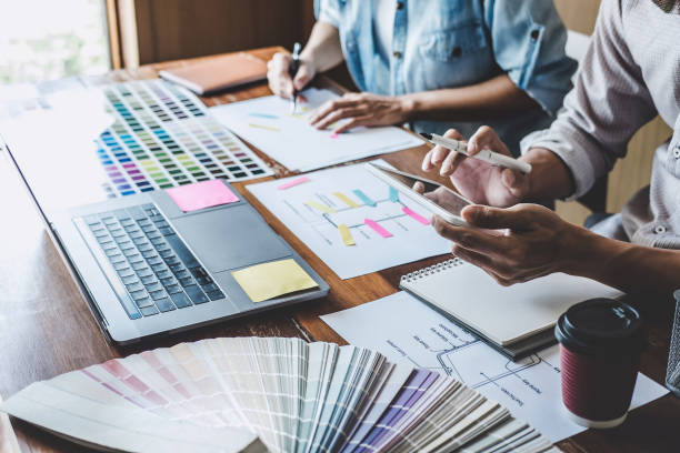 istock Team of Creative Web/Graphic Designer planning, drawing website ux app for mobile phone application and development template layout, process to developing prototype wireframe, User experience concept 1160817613