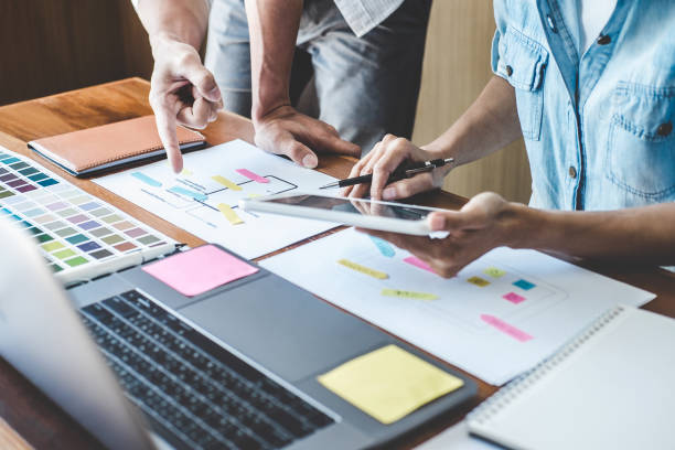 istock Team of Creative Web/Graphic Designer planning, drawing website ux app for mobile phone application and development template layout, process to developing prototype wireframe, User experience concept 1160817620