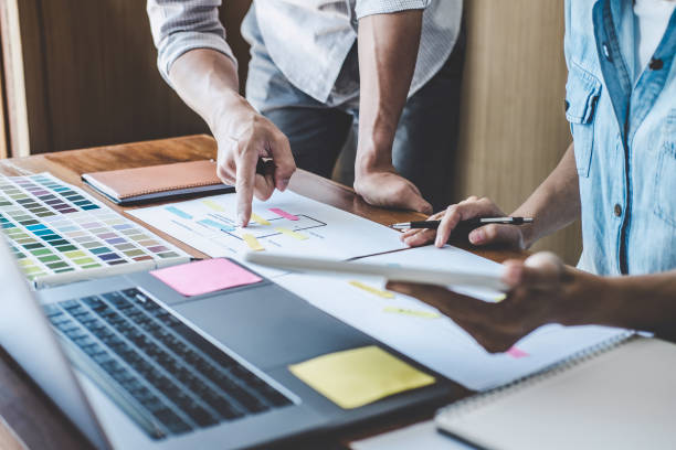 istock Team of Creative Web/Graphic Designer planning, drawing website ux app for mobile phone application and development template layout, process to developing prototype wireframe, User experience concept 1160817626