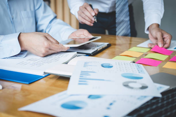 istock Co working conference, Business team meeting present discussing working analysis with financial data and marketing growth report graph in team, Finance, accounting, investment 1160817630
