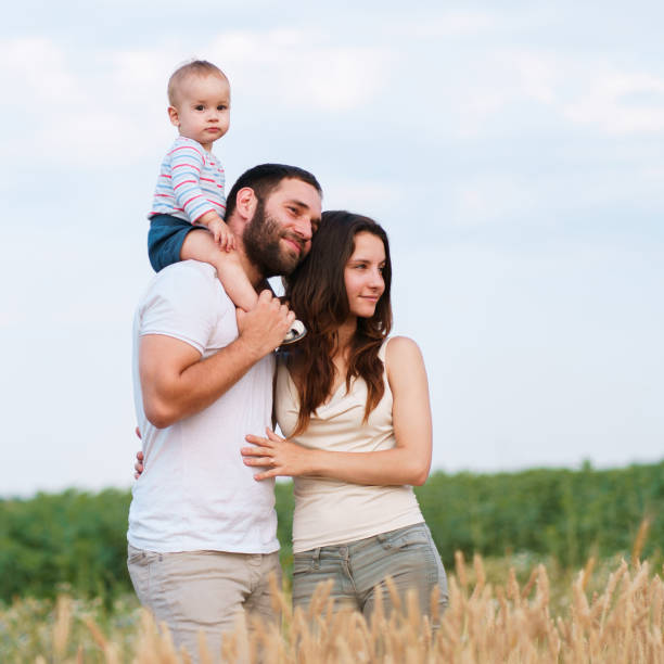 istock Daddy, mom and child having fun outdoors 1160819899